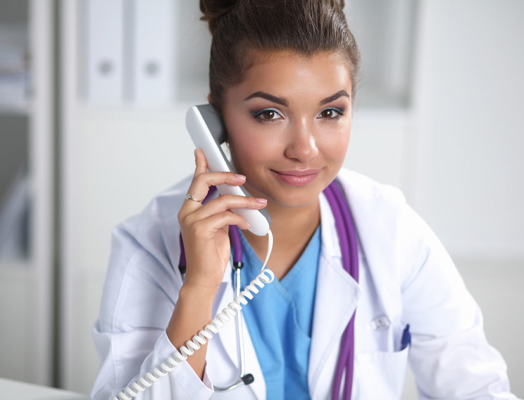 Photo of a female doctor talking on phone