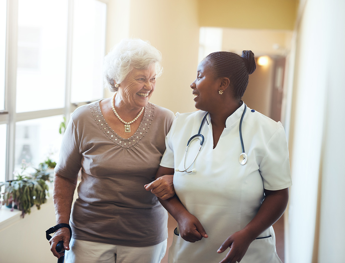 Nurse walking with elderly patient